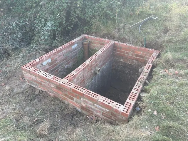 Brick manhole chamber being built in the ground. One of our jobs.