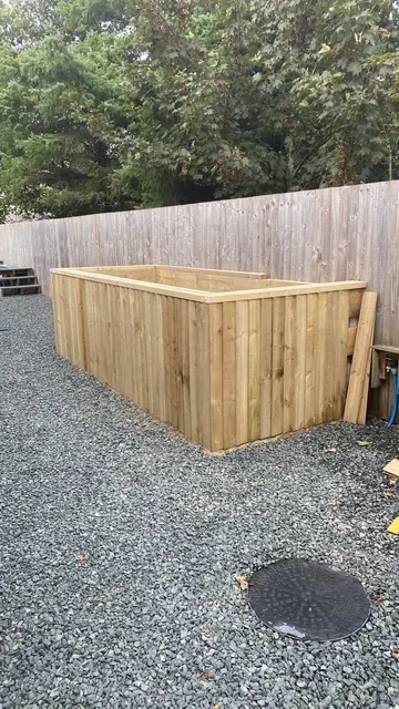 Raised timber planter on a gravel garden. One of our jobs.
